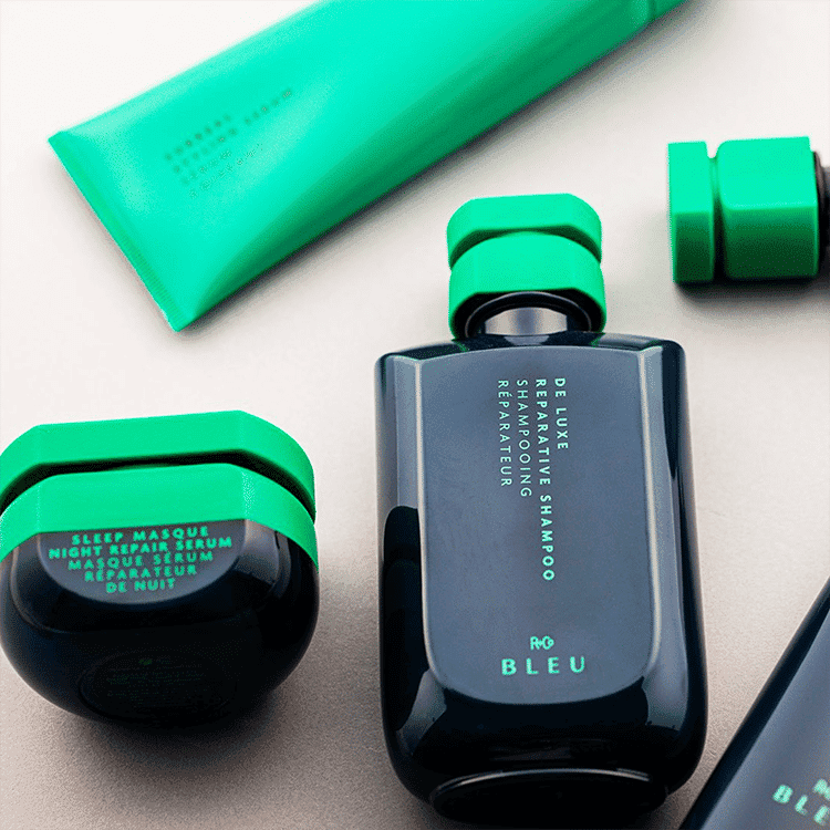 Luxurious teal and black haircare set, including shampoo, conditioner, and night masque.